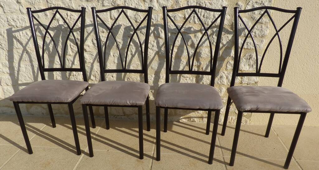 4 black metal chairs with high backs and gray suede tops
