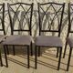 4 black metal chairs with high backs and gray suede tops