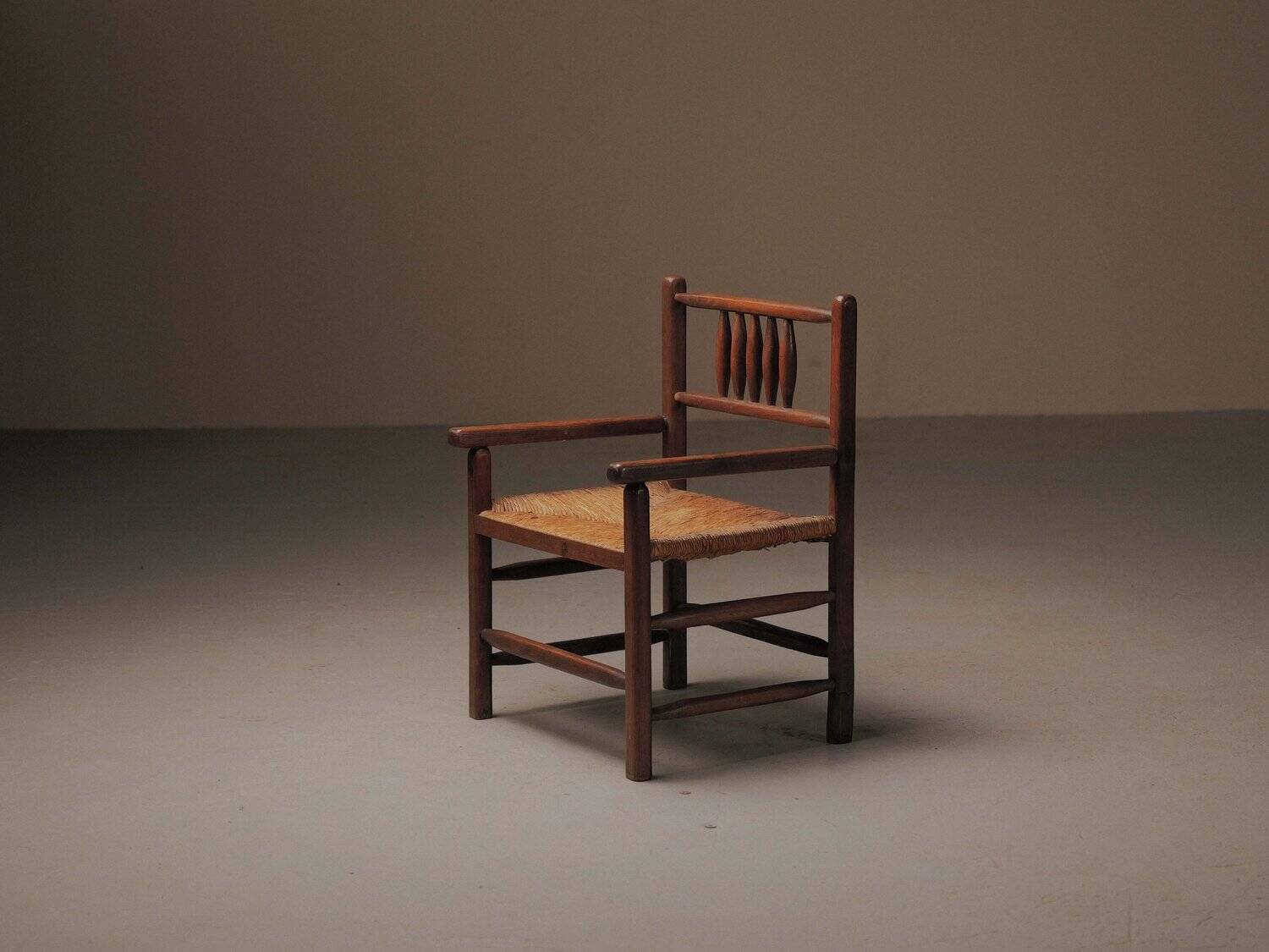 Wicker armchair in solid wood, handcrafted, France, around 1950.