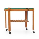 Wood and glass coffee table with wheels, 1960s.