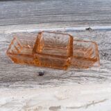 Glass condiment service in transparent pink moulded glass.