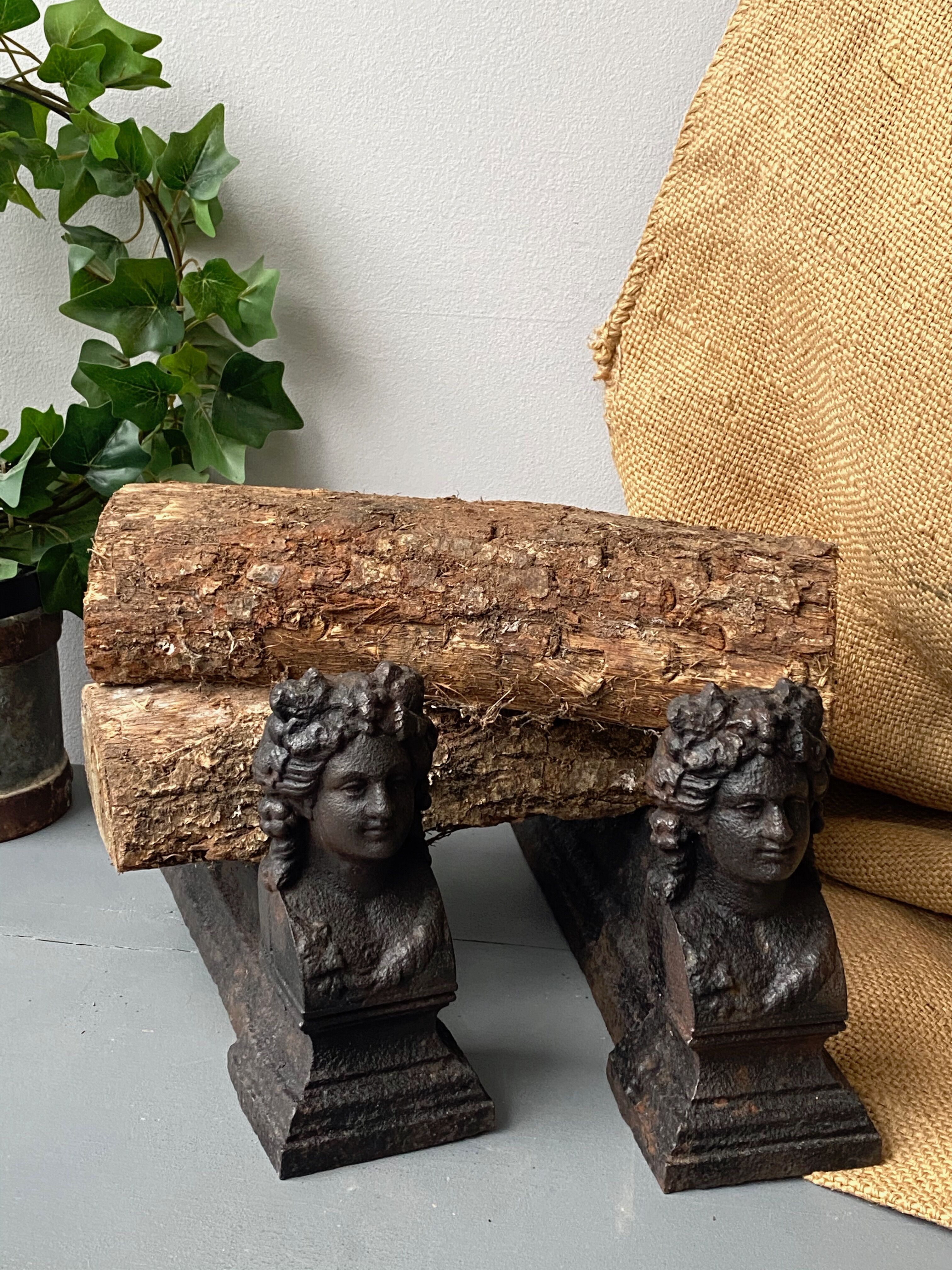 Pair of cast iron pegs