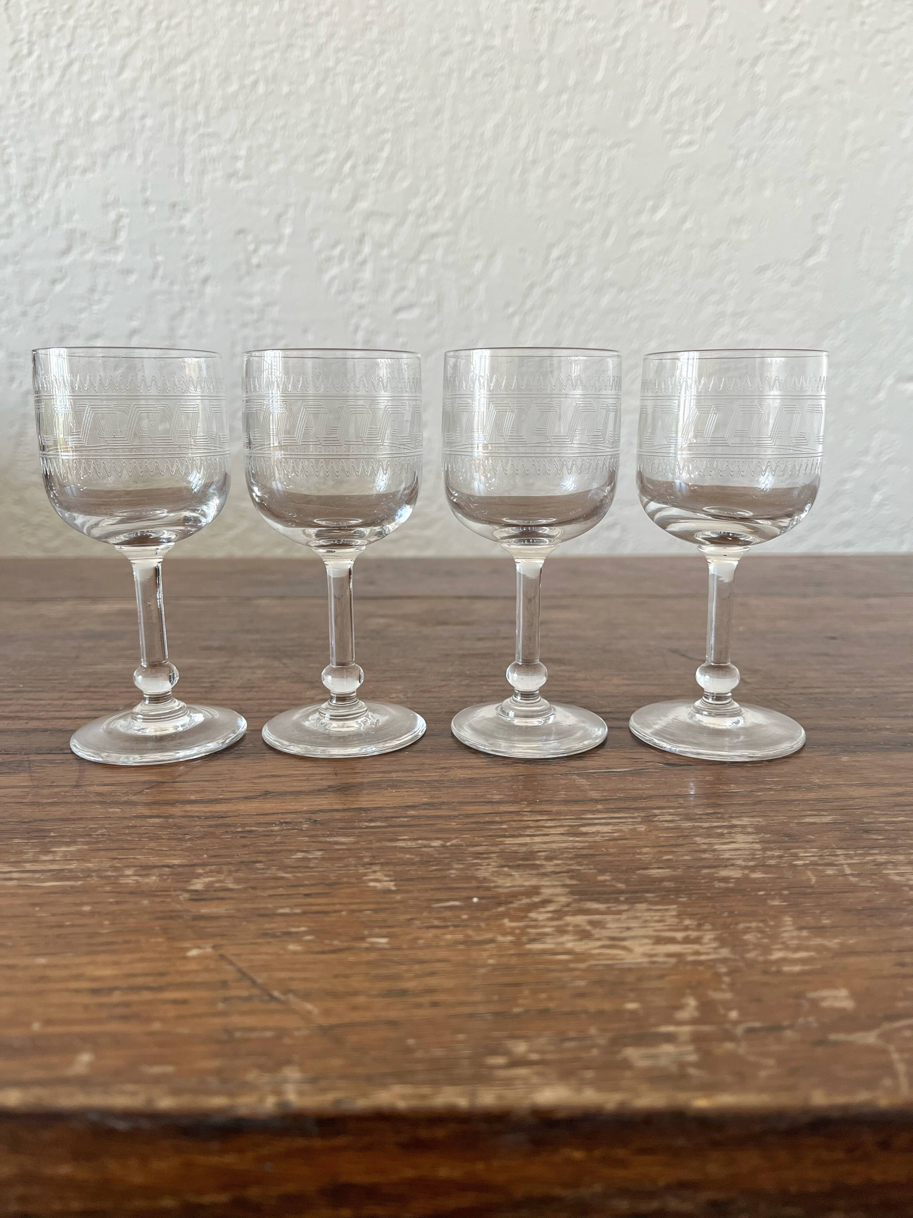 Four antique stemmed liqueur glasses in engraved crystal, 19th century