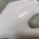 White ceramic hand wall lamp