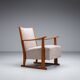 Oak armchair with curved armrests
