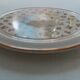 Vintage round trivet, ideal for adding a romantic touch.