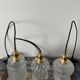 Set of three vintage electrified glass pendant lamps