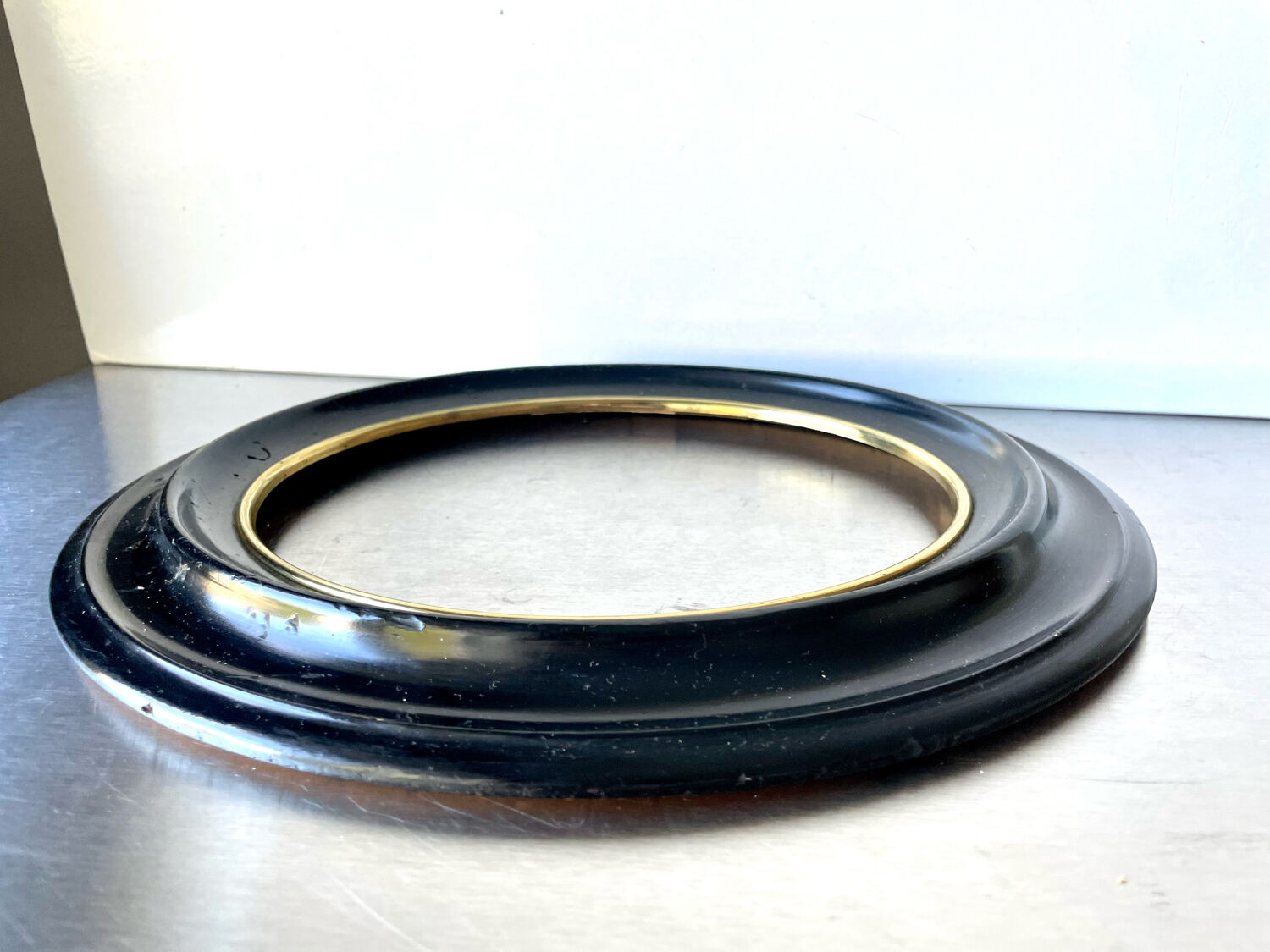Black wooden oval frame