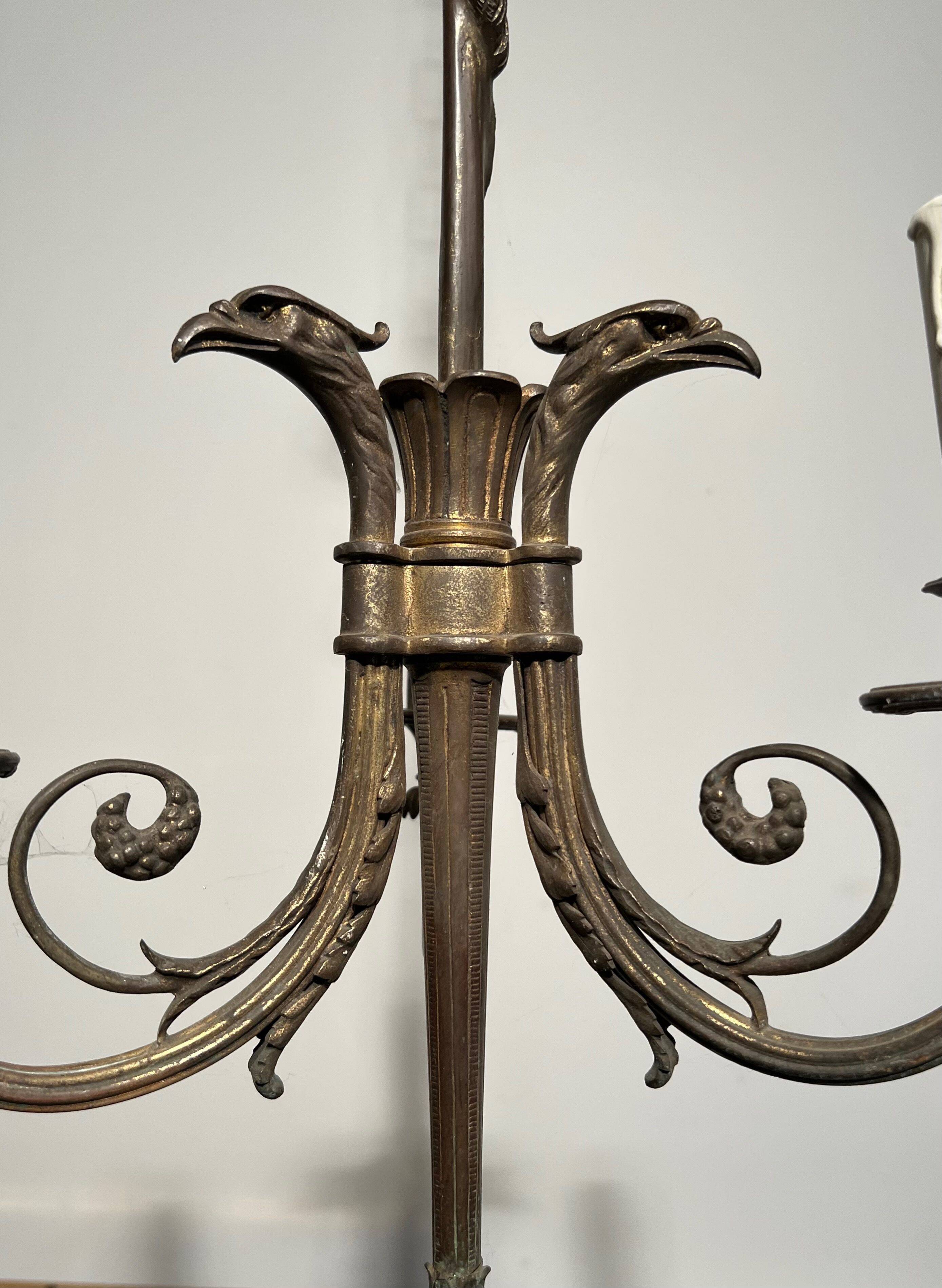 Empire-style bronze chandelier with 3 arms of light topped with eagle heads. French work. Circa 1900.
