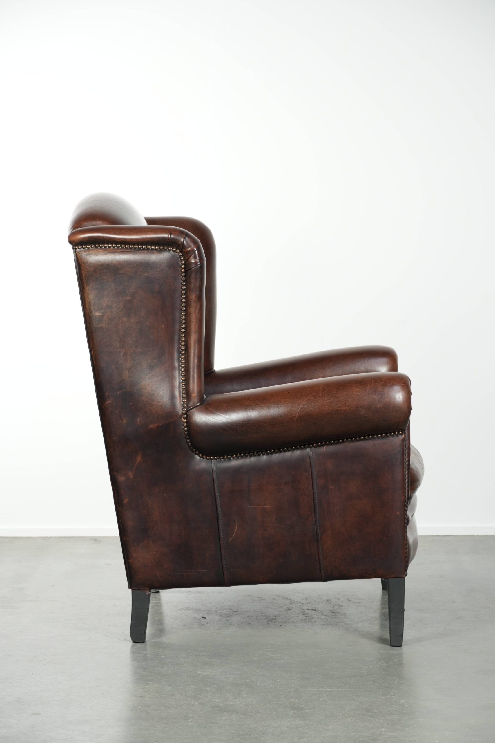 Sheepskin wingback armchair with beautiful deep and warm colours