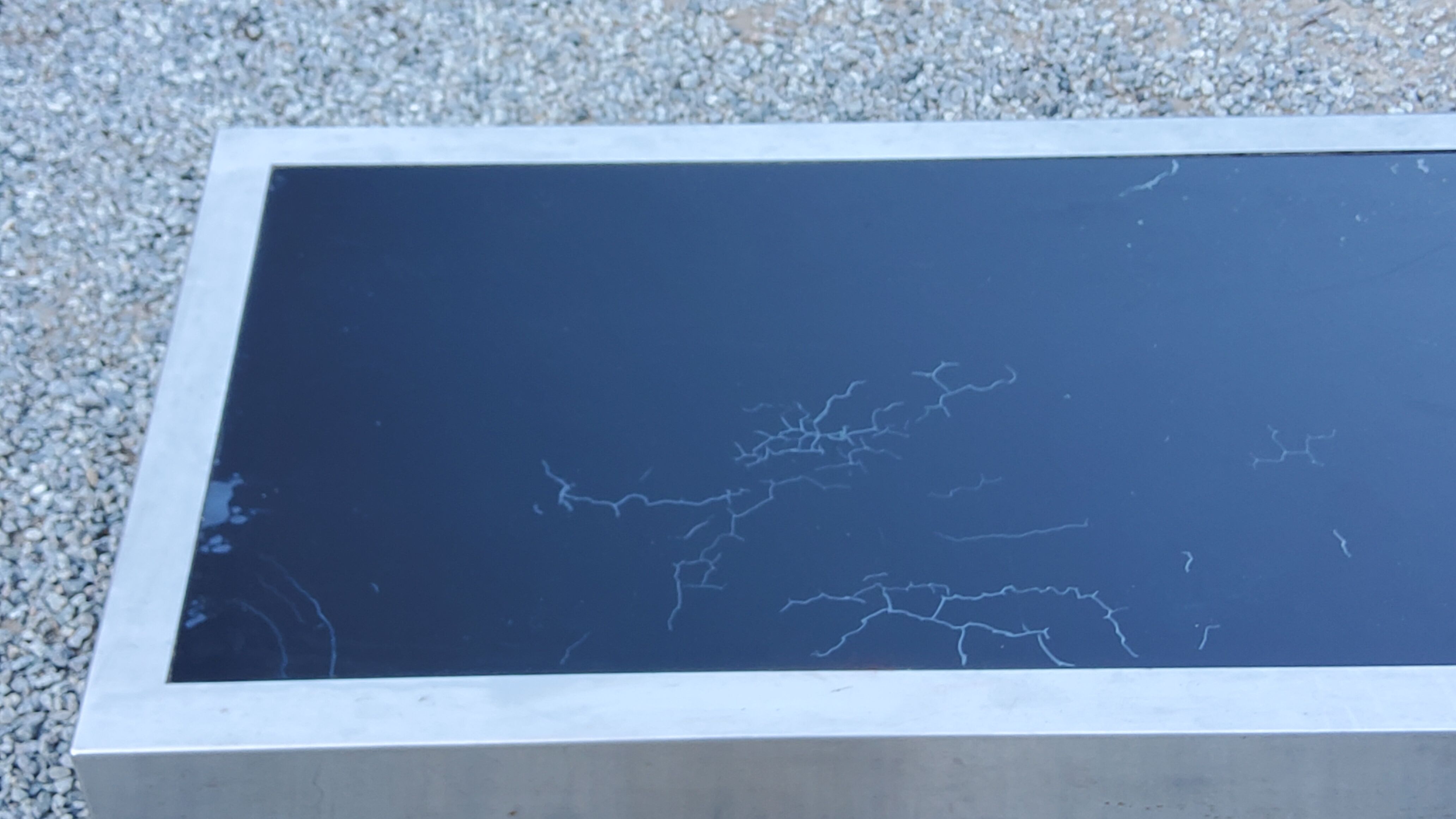 Coffee table in brushed steel and black tinted glass from the 70s