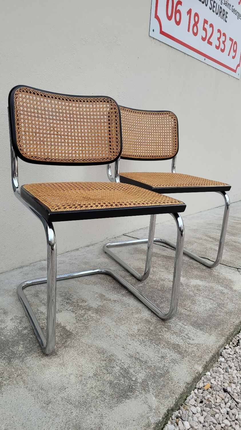 Pair of chairs by Marcel Breuer in black canework model B32 signed Italy