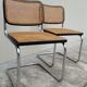 Pair of chairs by Marcel Breuer in black canework model B32 signed Italy