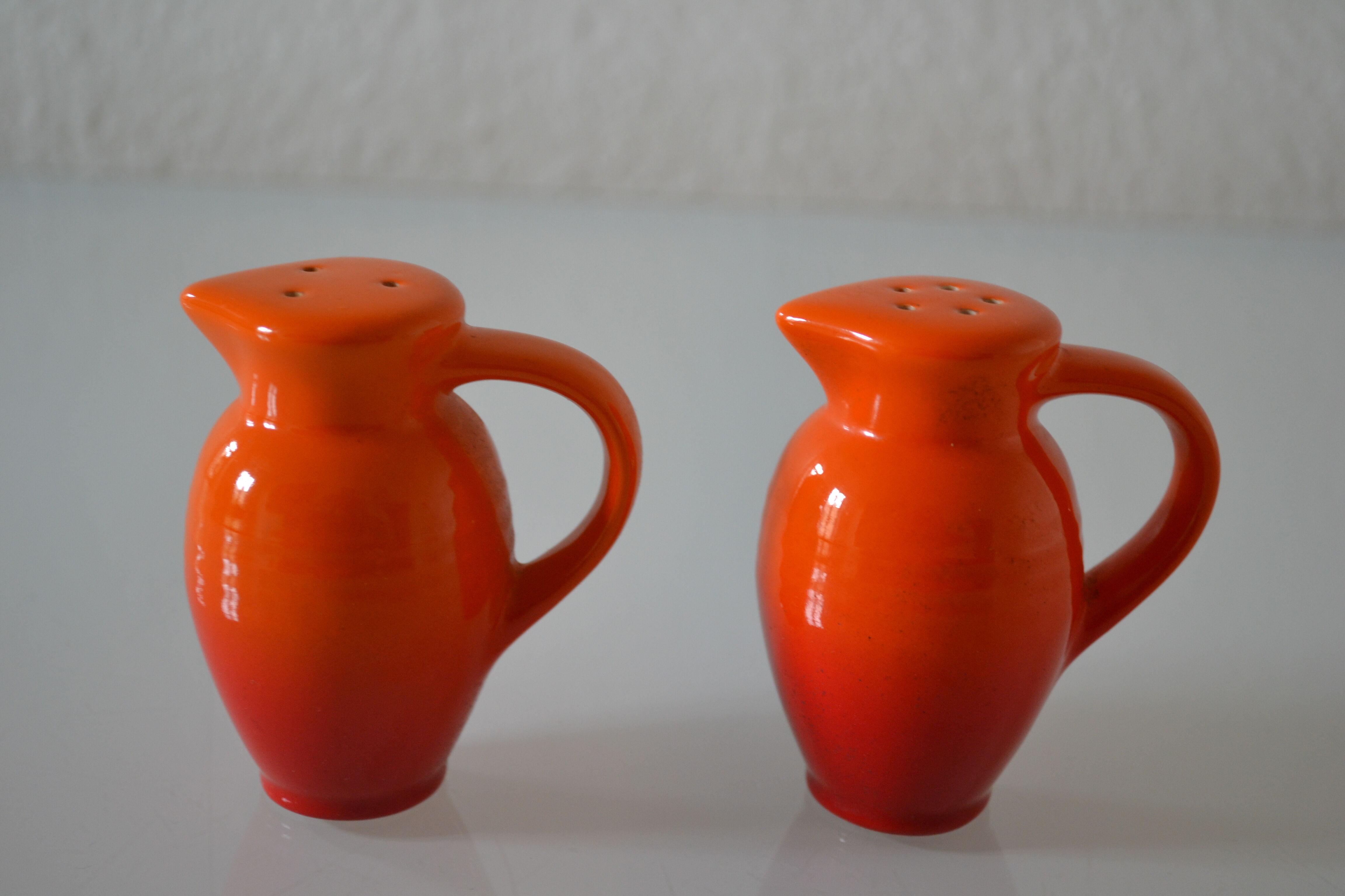 Le Creuset orange advertising salt and pepper