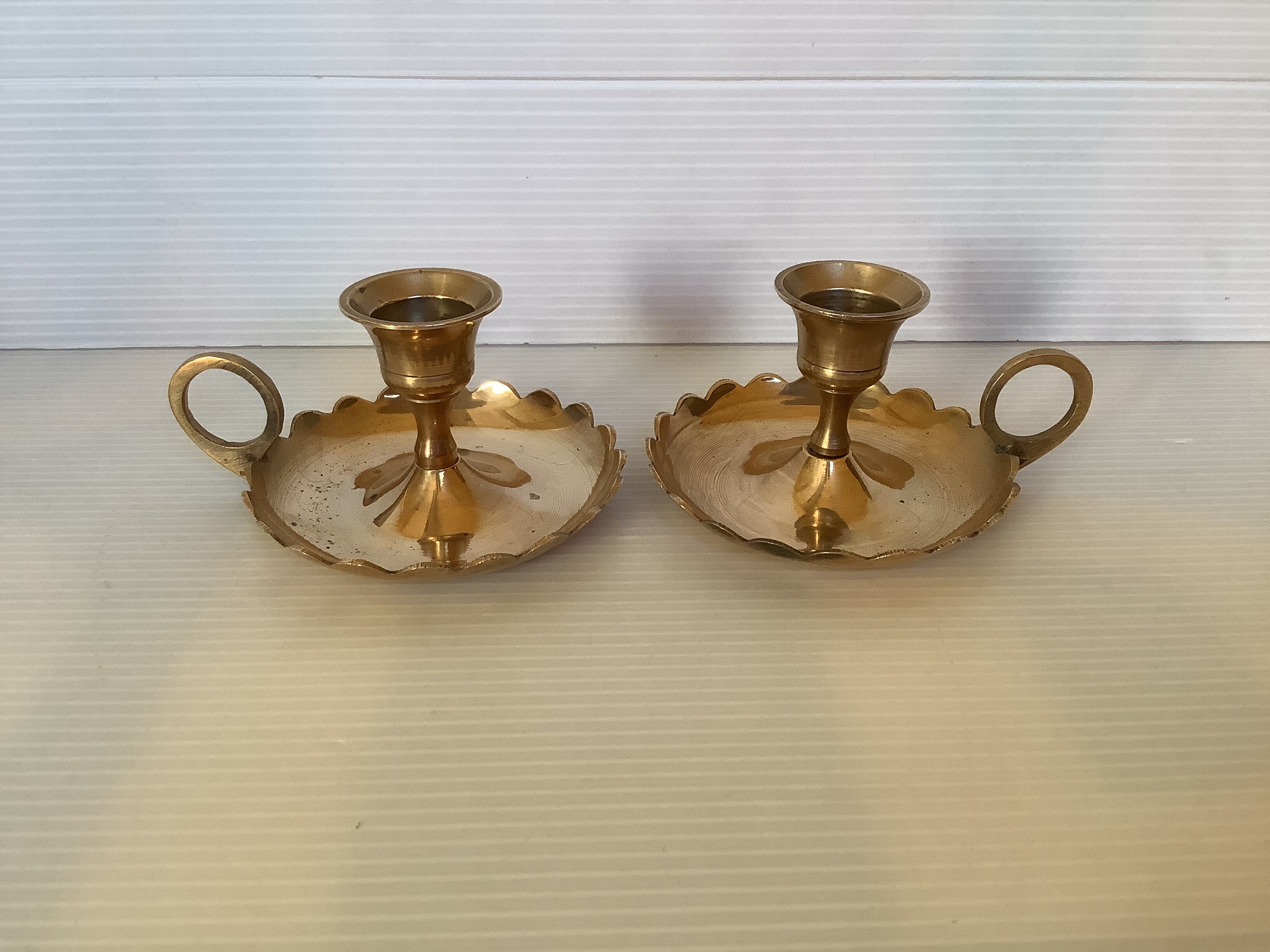 Pair of brass cellar rat candle holders
