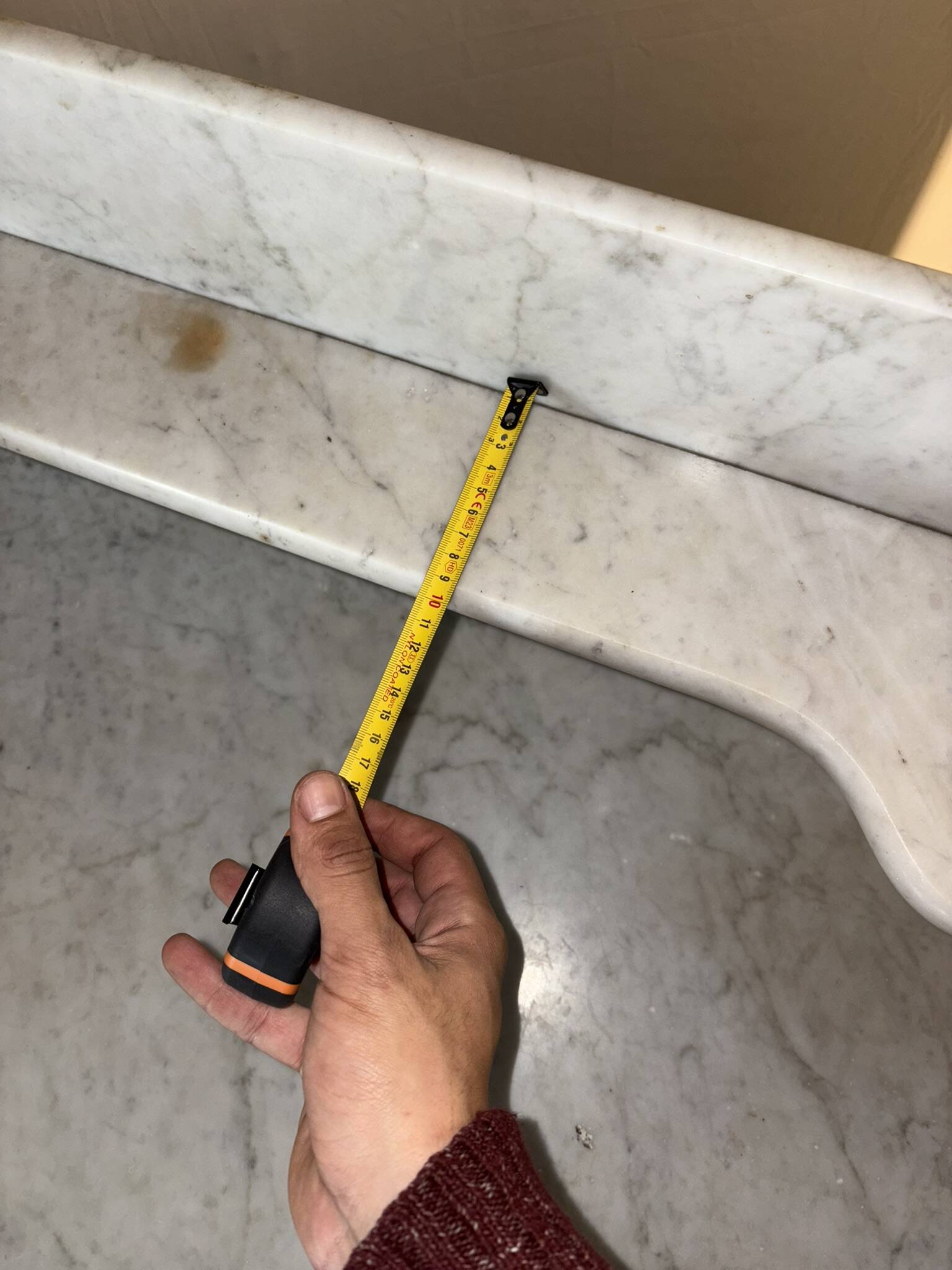 Antique wood and marble kitchen sideboard with carved backsplash