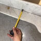 Antique wood and marble kitchen sideboard with carved backsplash