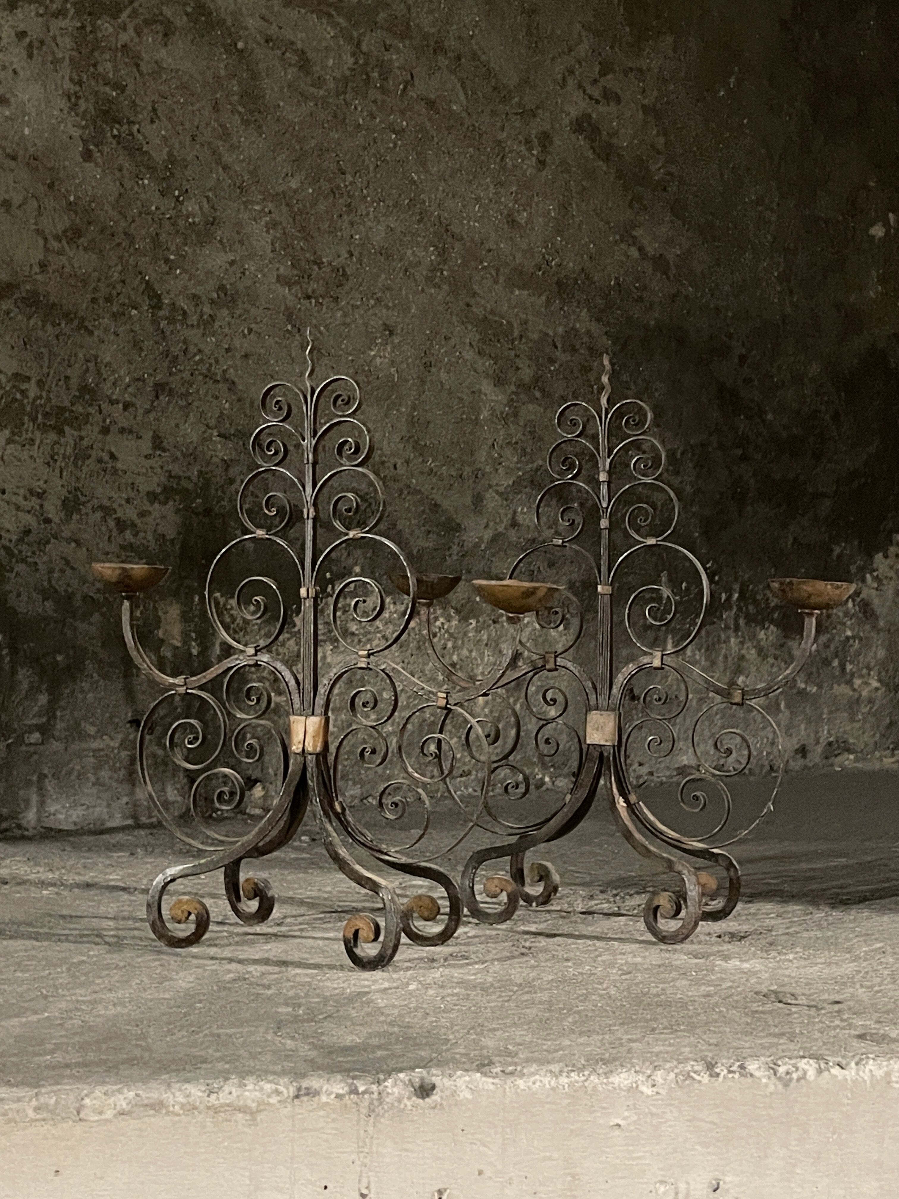 Pair of French wrought iron candelabra from the 19th century.