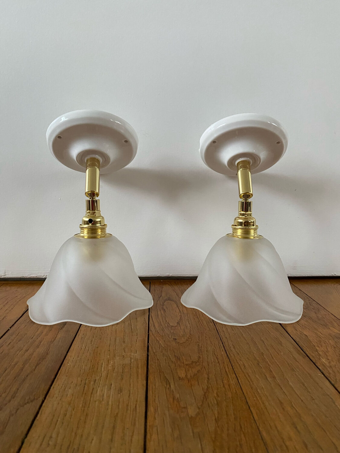 Pair of wall sconces with vintage globes