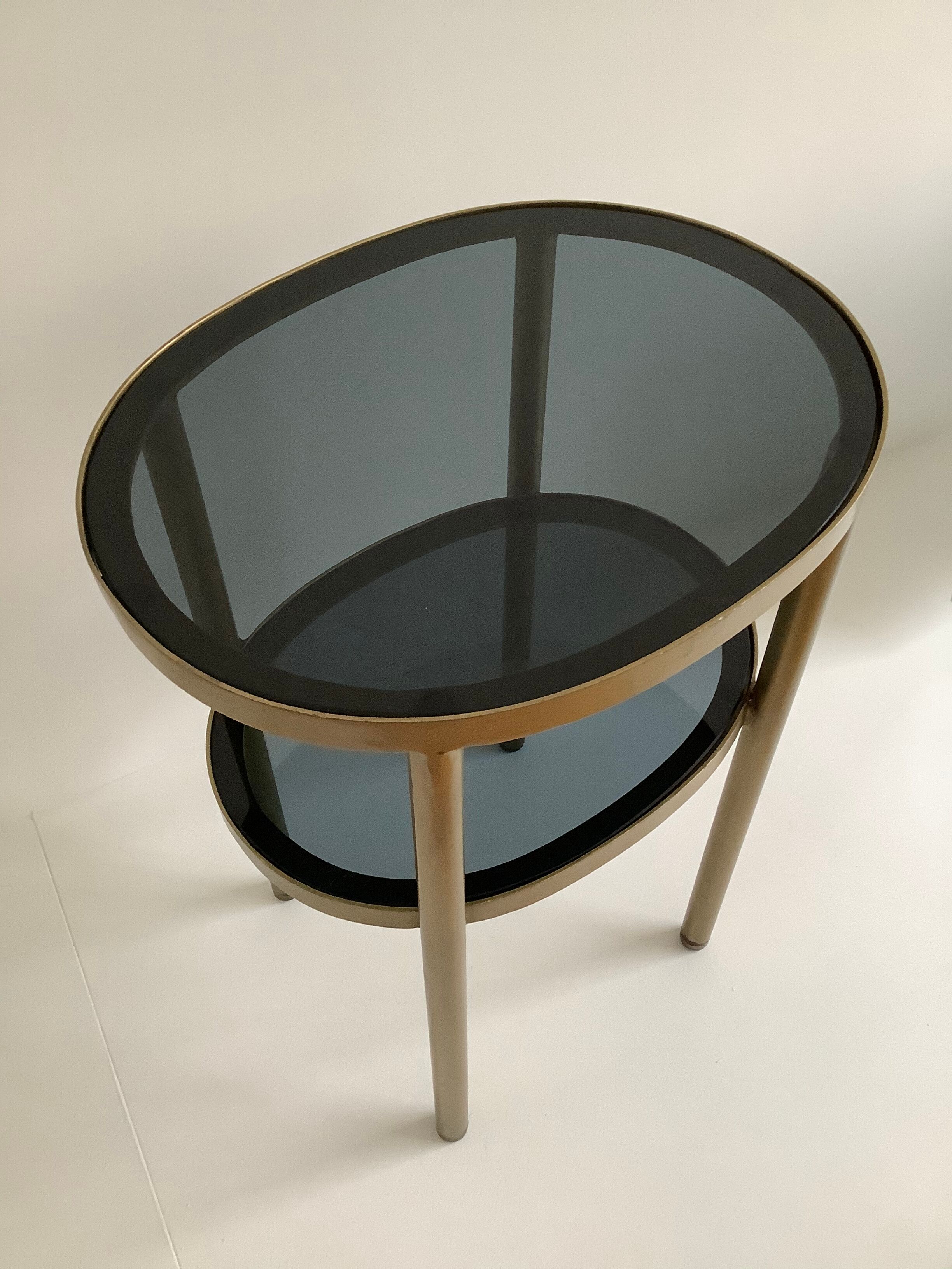 Brass side table and smoked glass