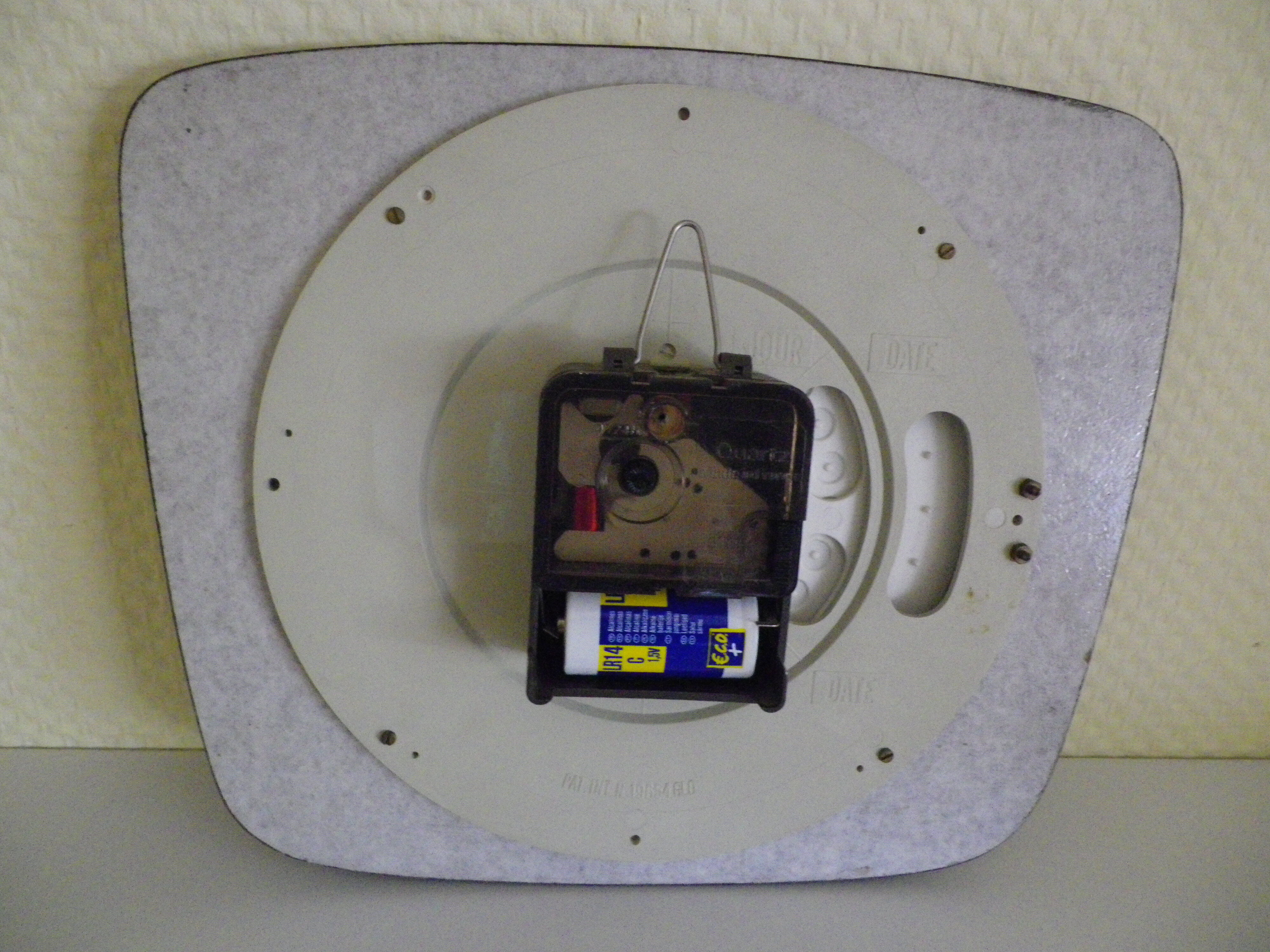 Formica wall clock with day and date - 1970s