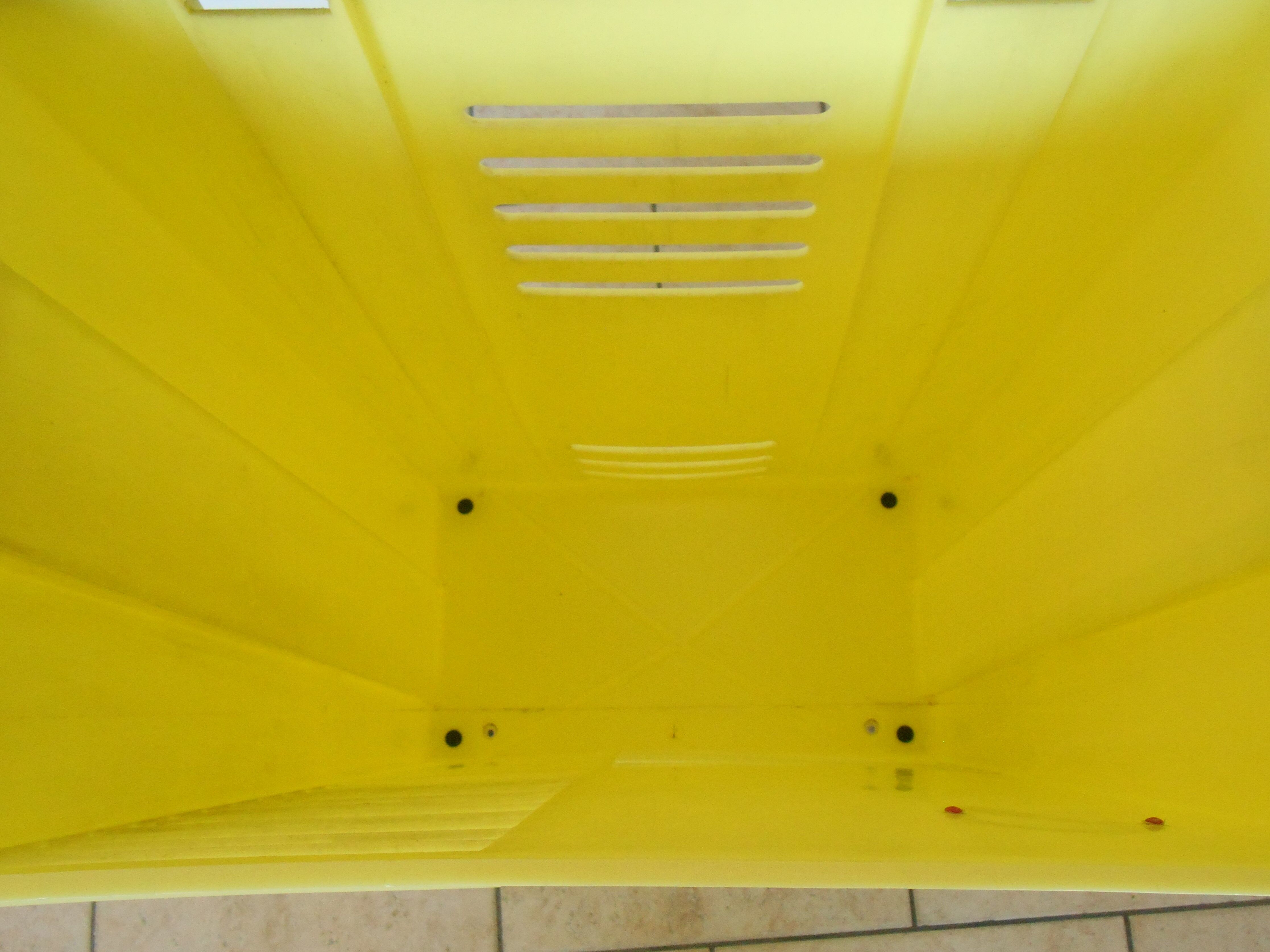 Vintage laundry basket in yellow and black plastic