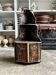 Black lacquered wooden corner cabinet with polychrome decoration, 18th century.