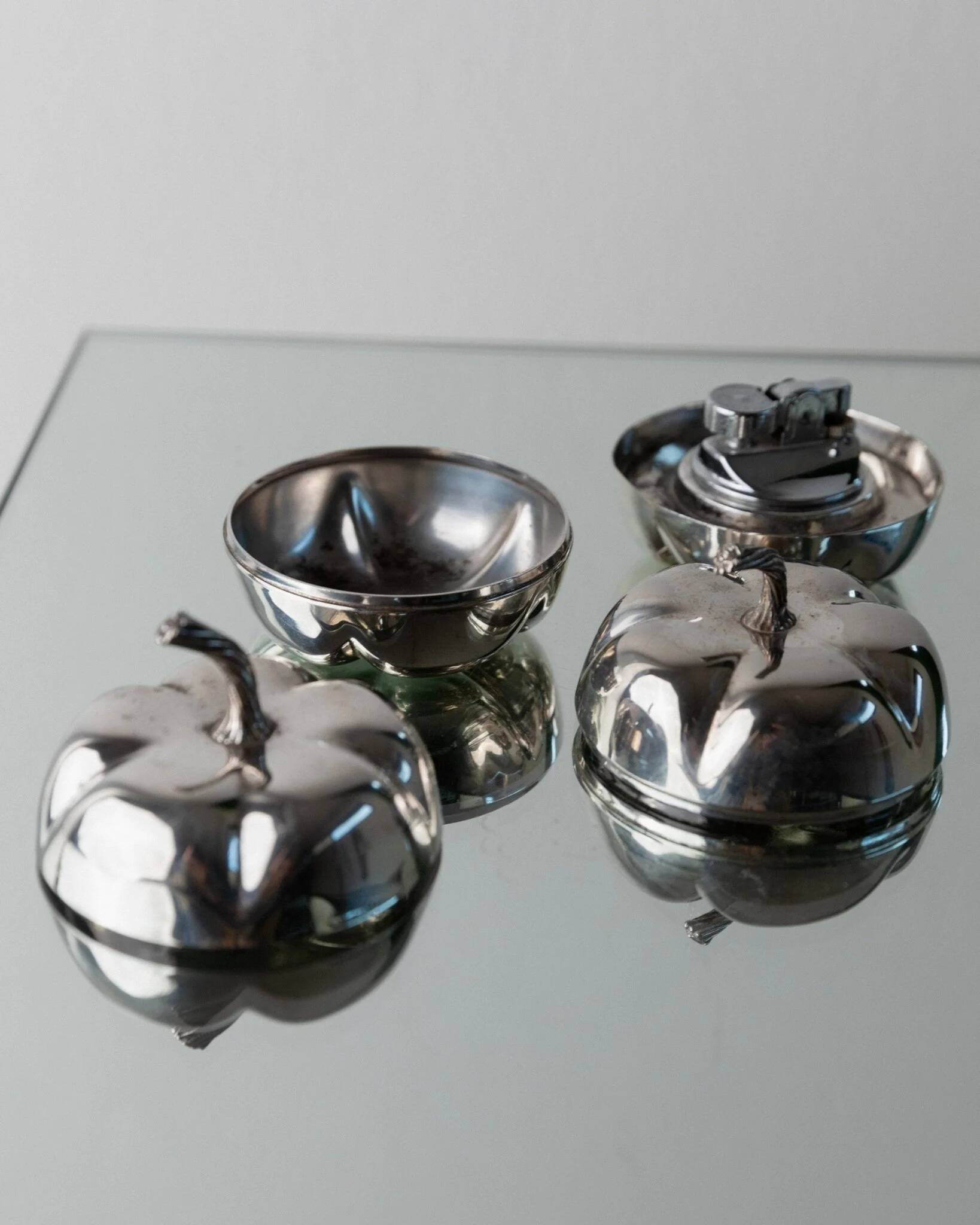Silver-plated vintage Christian Dior Pumpkin set: two lidded metal bowls with removable integrated lighter, 1970s