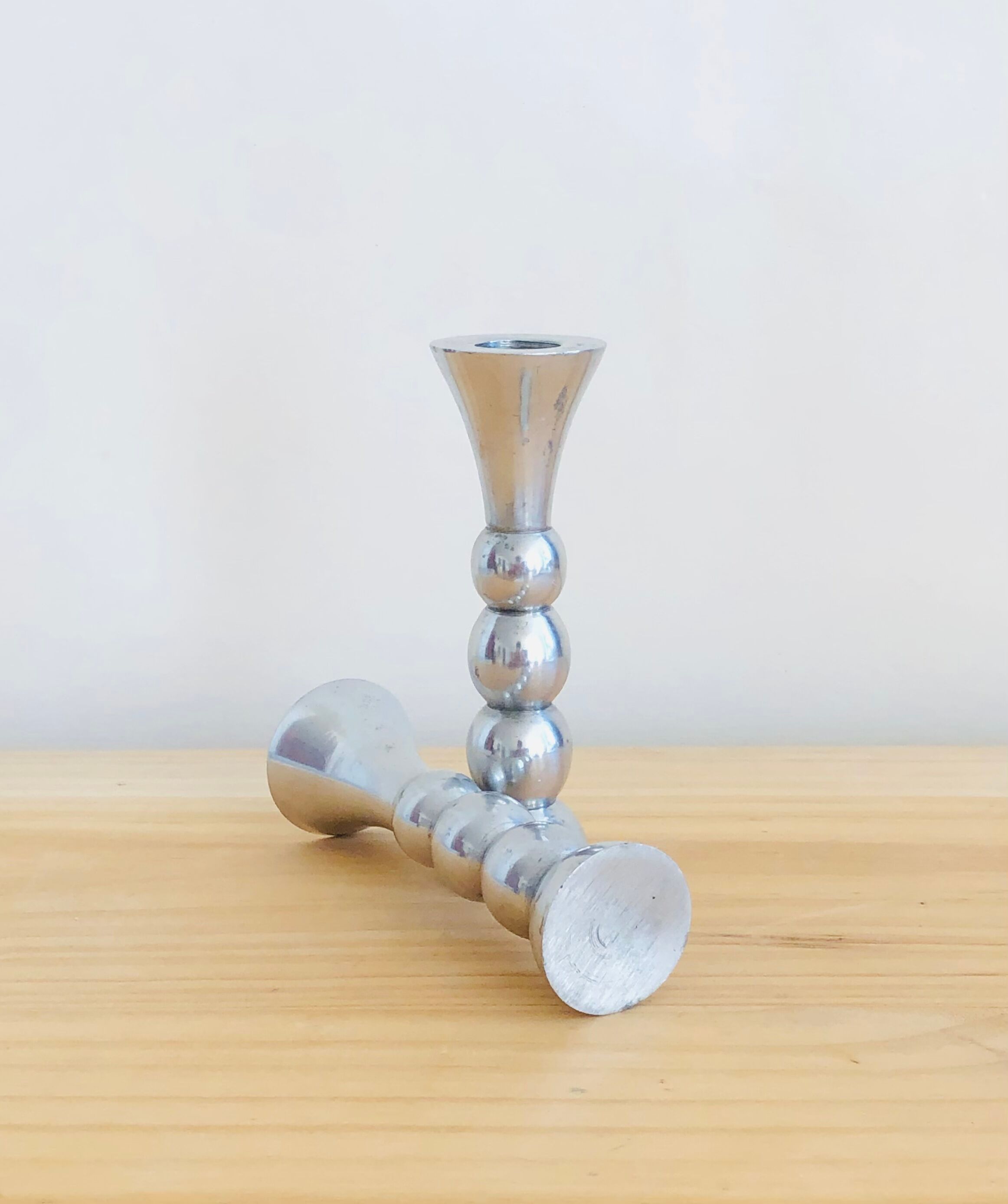 Pair of vintage cast aluminum candle holders