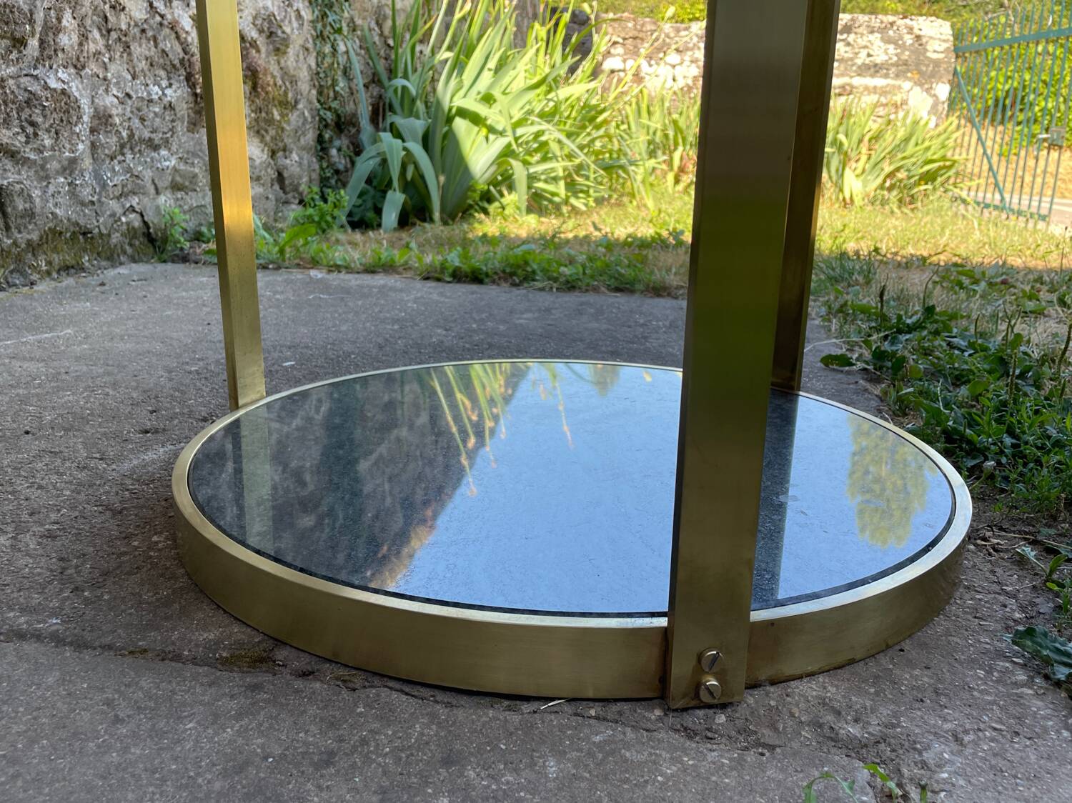 Round dining table with green marble and solid brass.