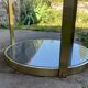 Round dining table with green marble and solid brass.