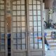 Two pairs of solid oak doors with small panes.