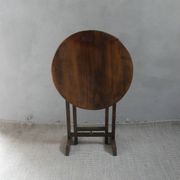 Small table known as a winemaker's table.