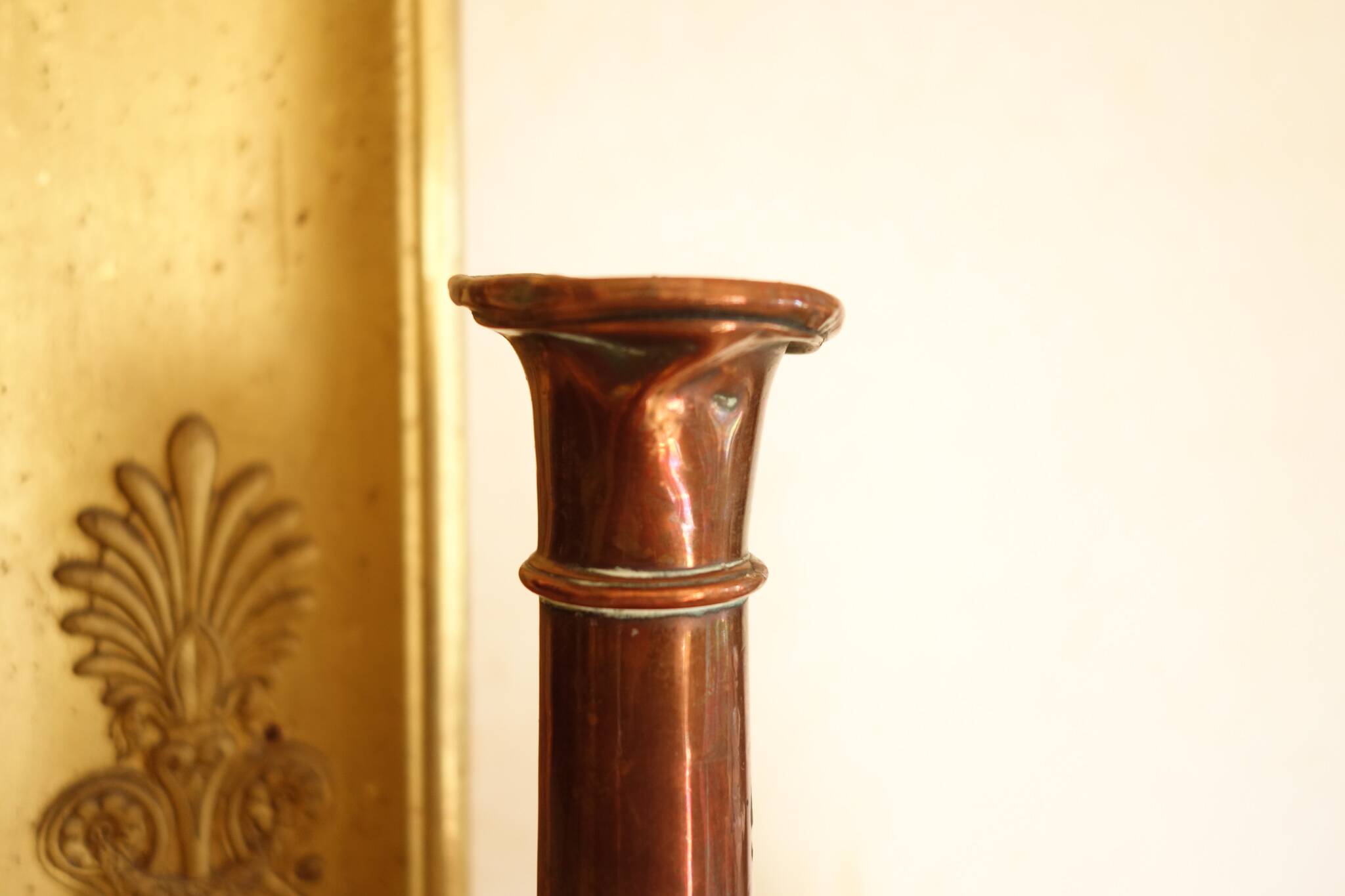 Pair of antique copper candlesticks