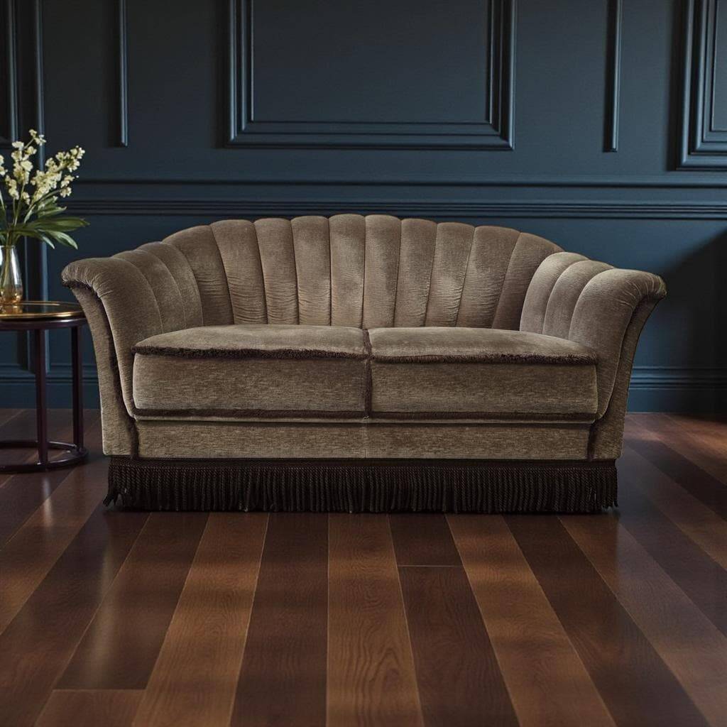 Vintage taupe two-seater canapé with fringes.