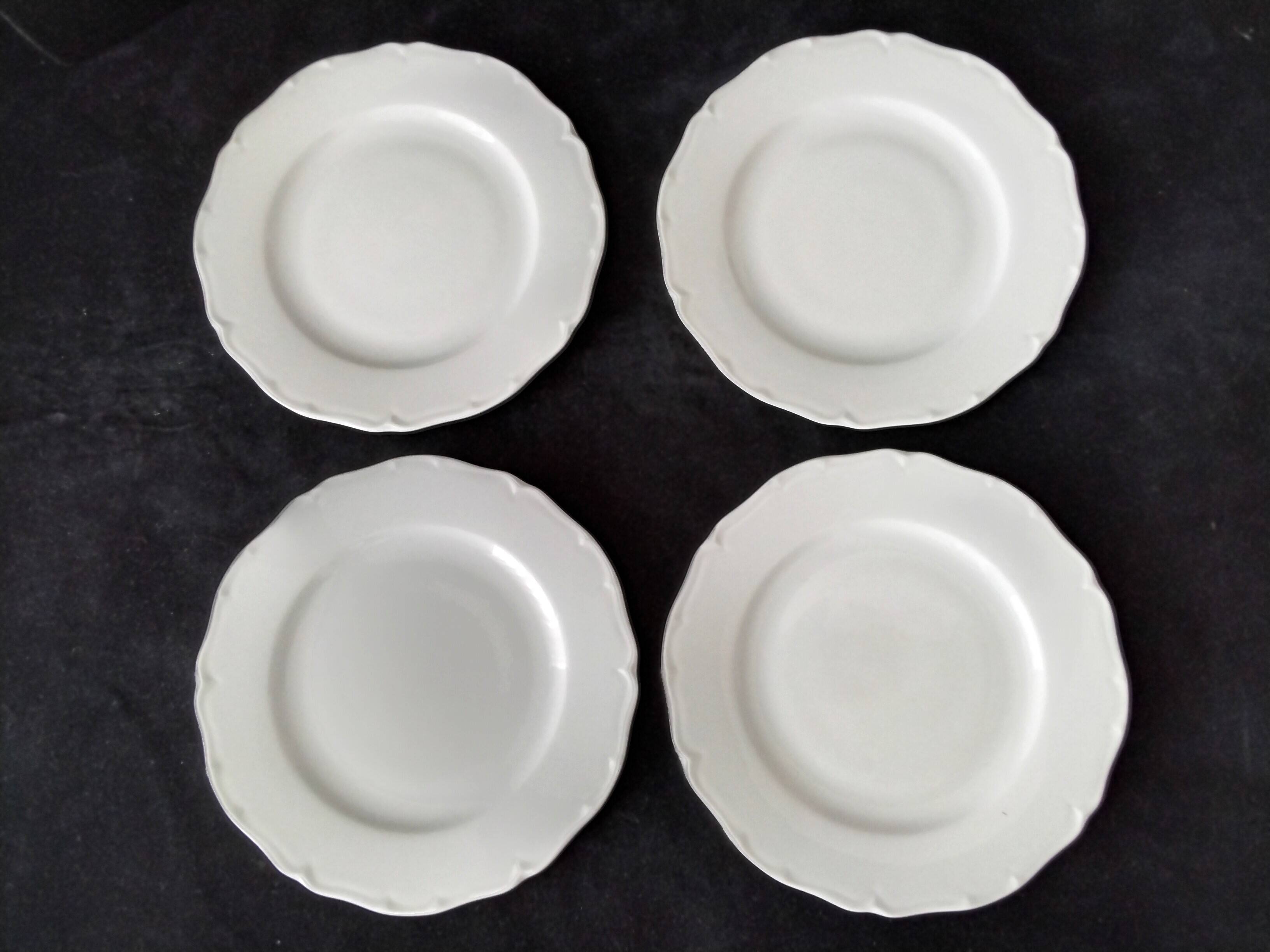 4 white Limoges porcelain dessert plates