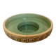 Green ceramic candle holder with a frieze