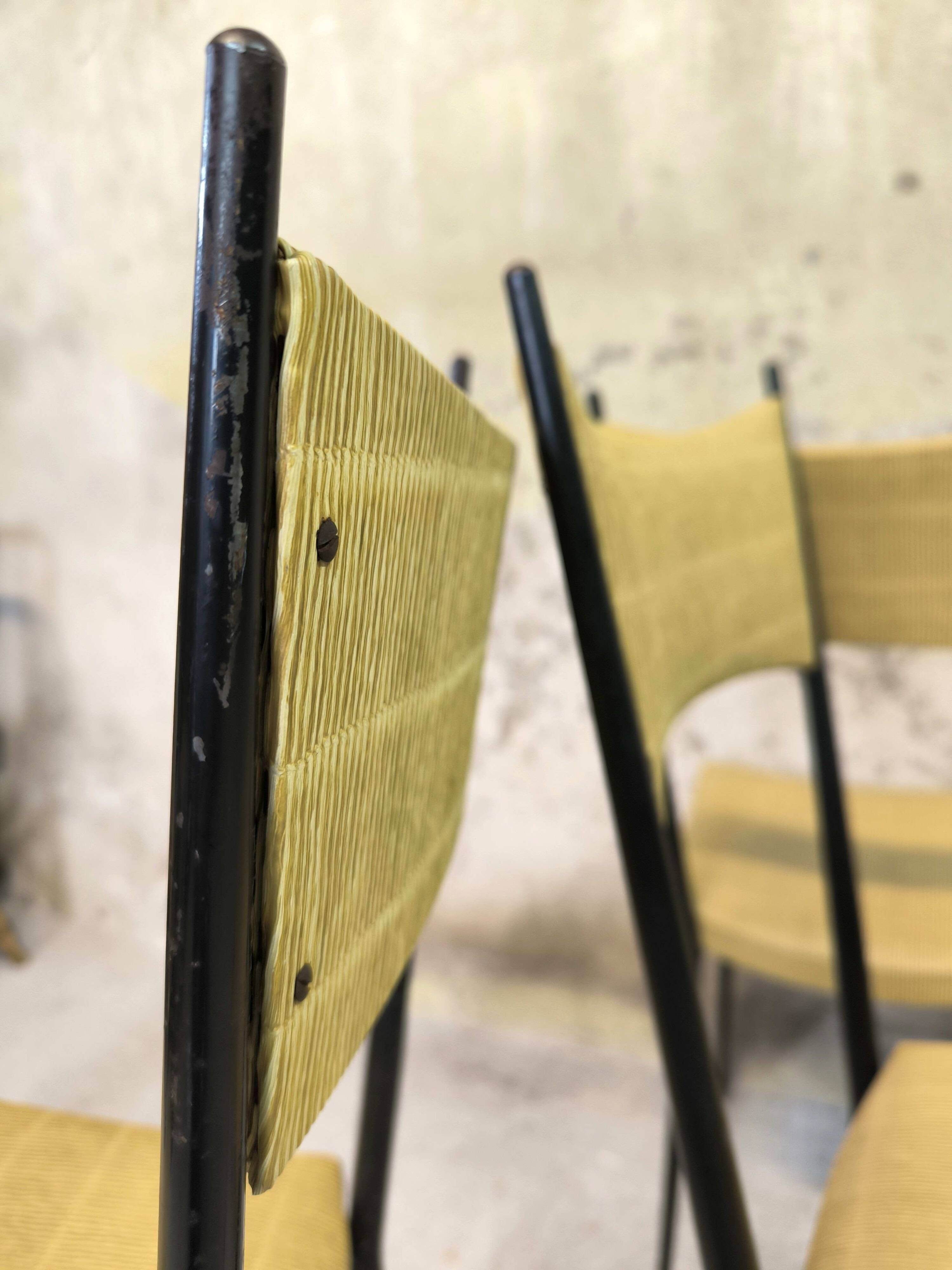 Three vintage chairs in the style of Colette Gueden.