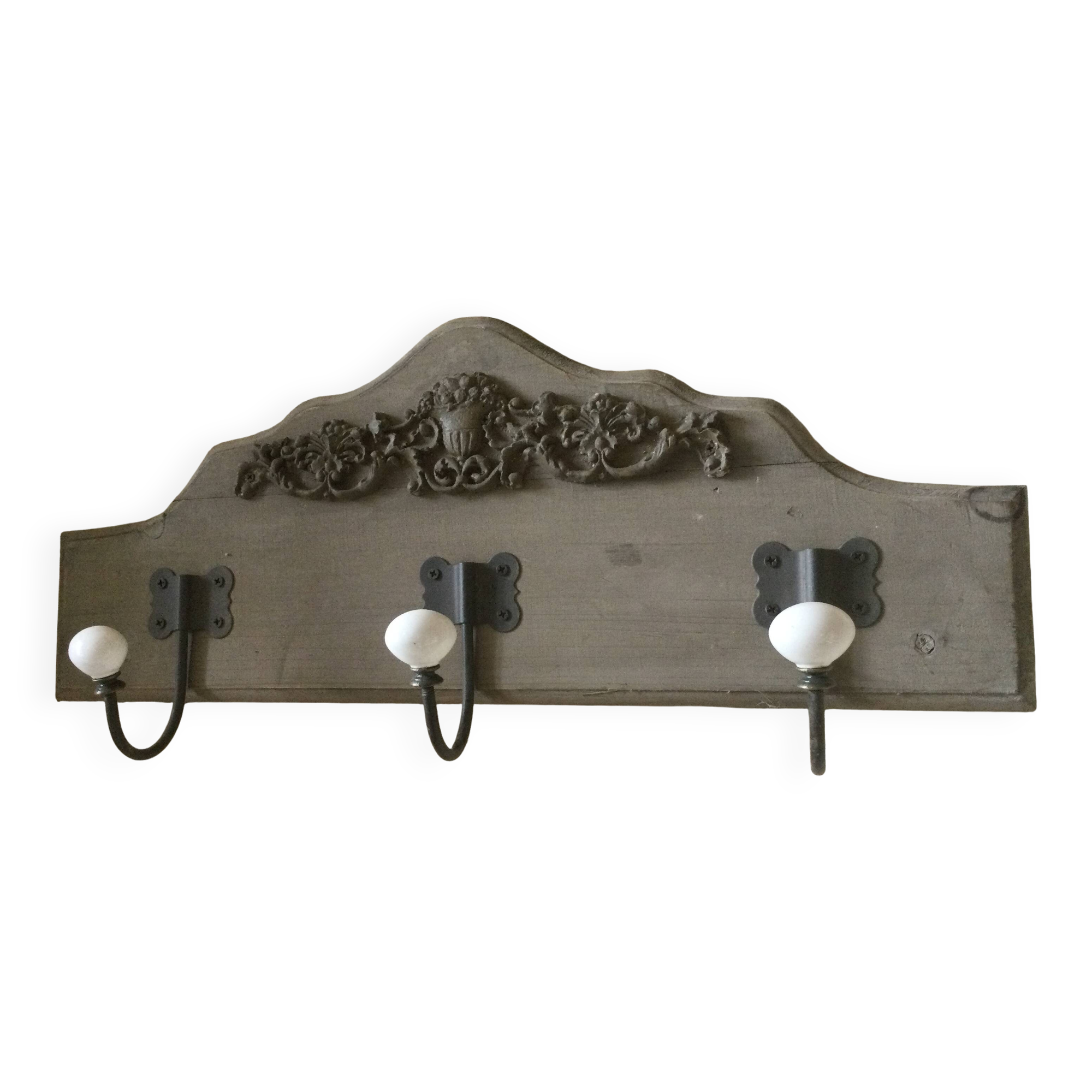 Wall-mounted wooden coat rack with 3 hooks.