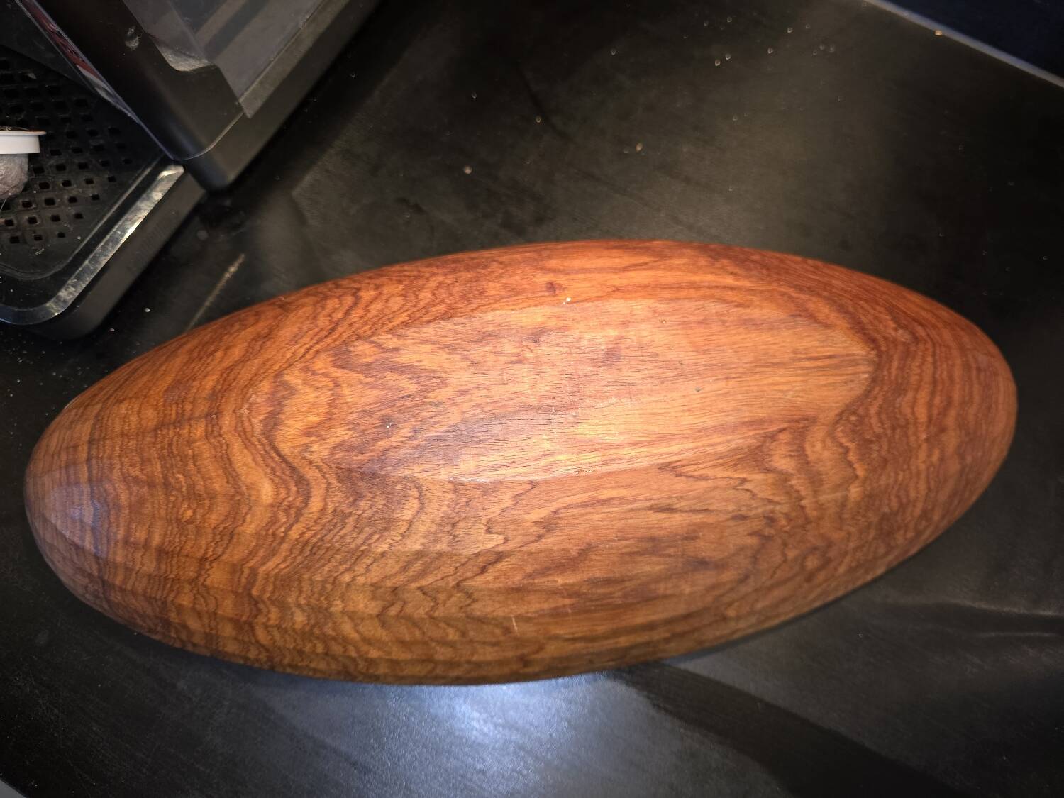 solid wood shuttle with a sleek and organic design.