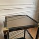 Pair of vintage metal and smoked glass side tables