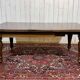 Victorian-style mahogany English table with 3 extensions.