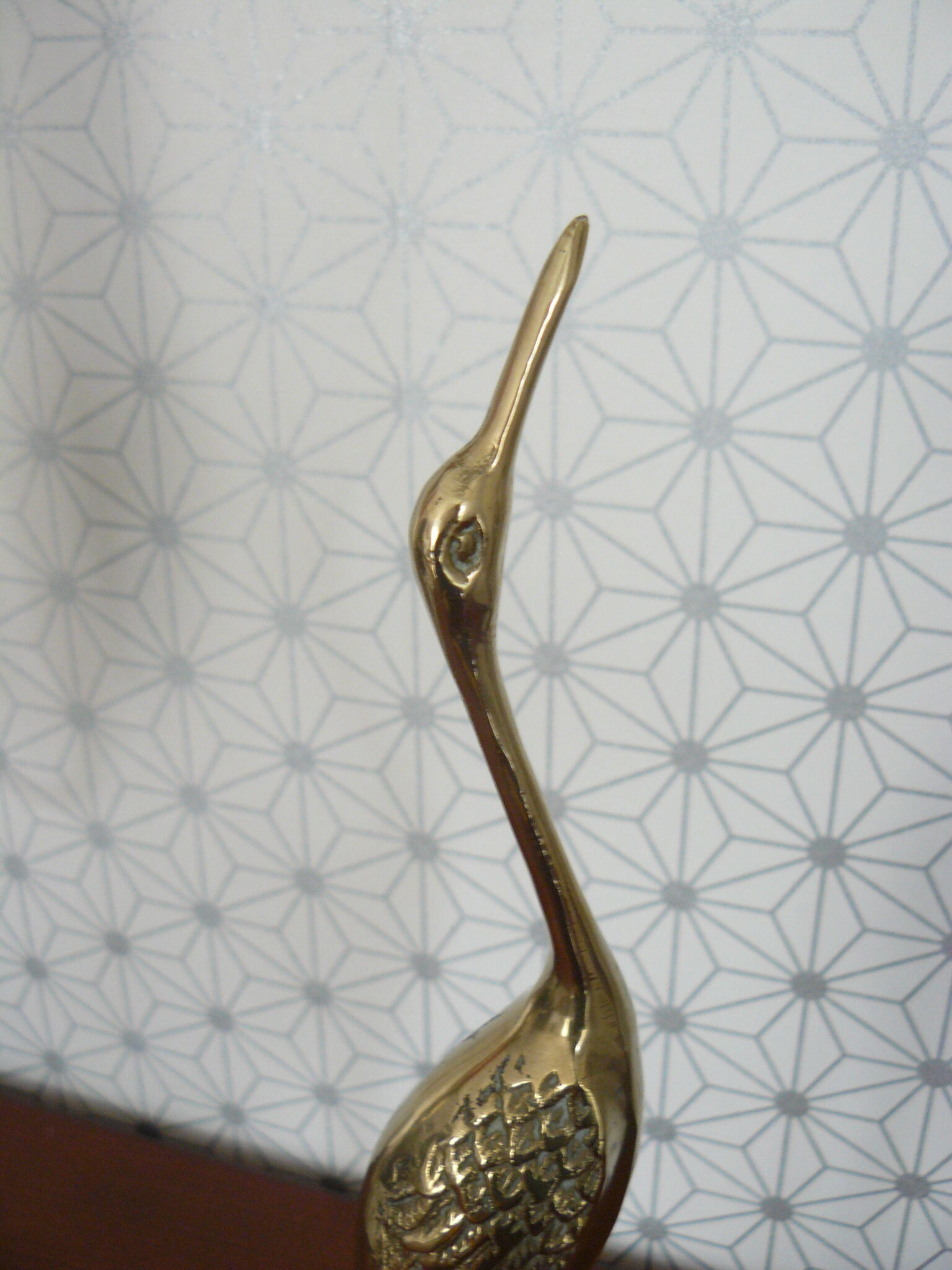 Heron in vintage brass