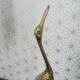 Heron in vintage brass