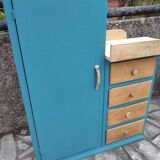 Asymmetrical changing table cabinet