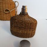 Trio of woven wicker bottles