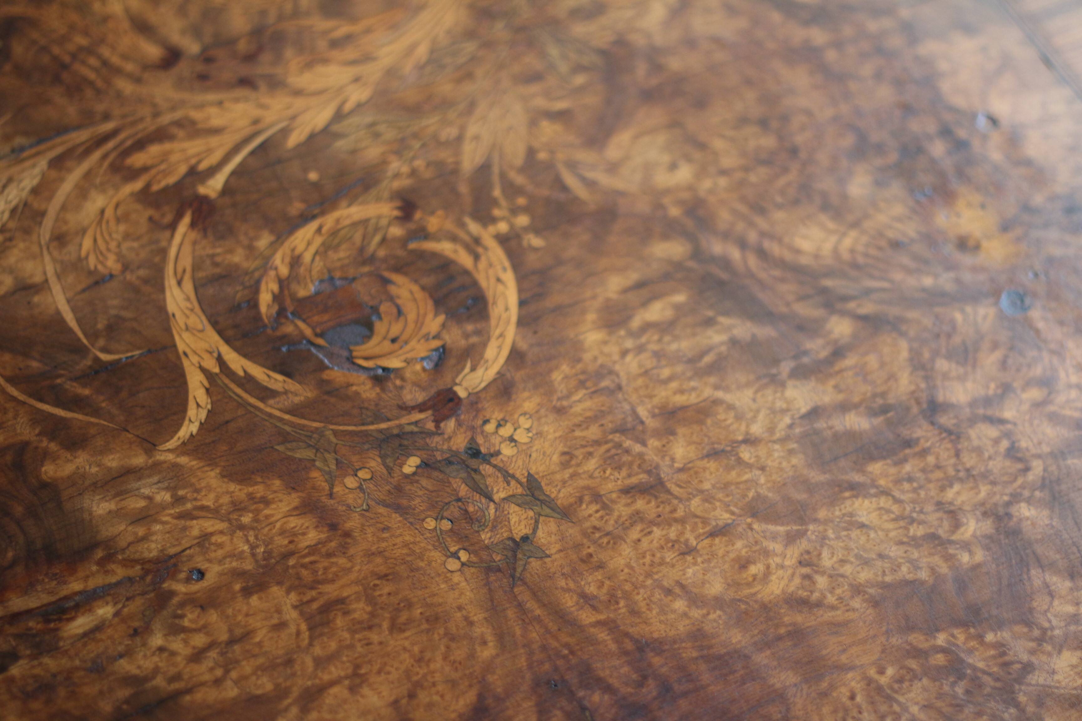 Superb Napoleon III table. Marquetry top and gilded bronzes.