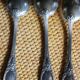A set of 6 silver-plated metal soup spoons with foliage design.