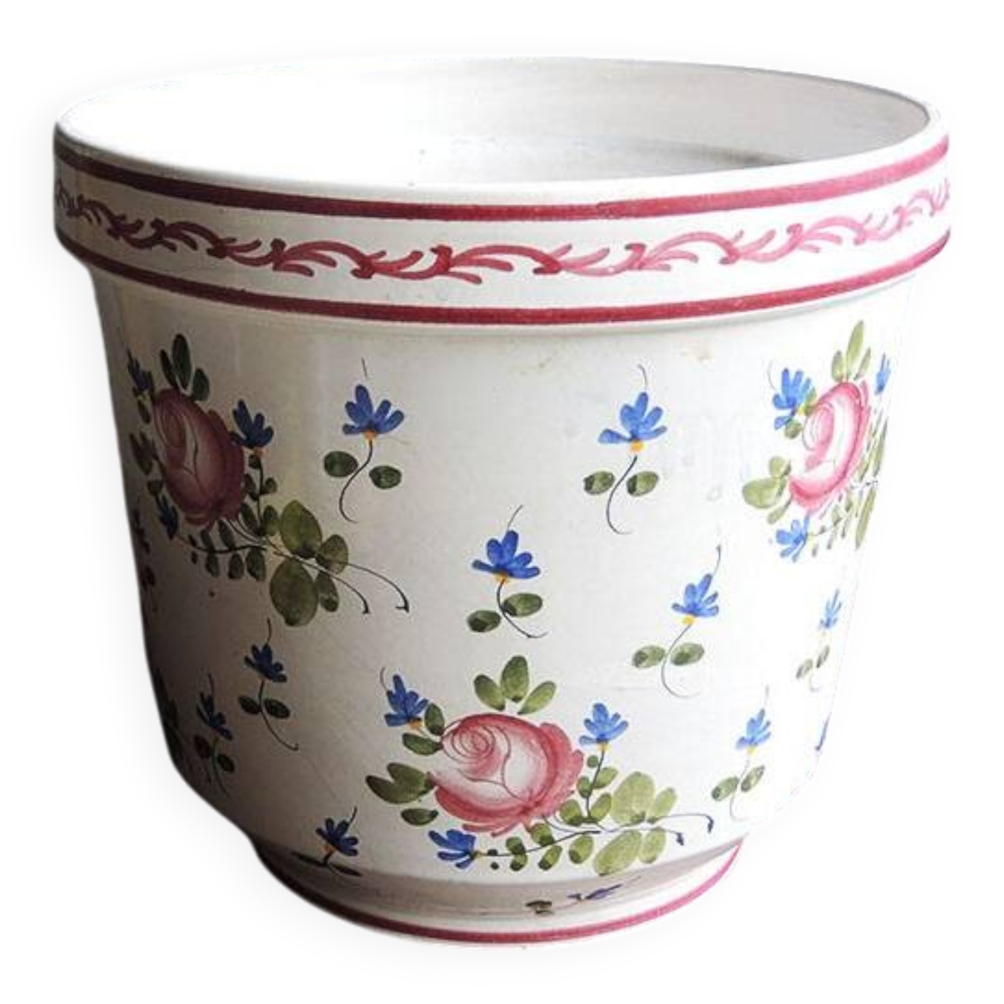 Vintage ceramic pot with hand-painted floral decoration.
