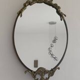 Antique mirror, oval with brass crest